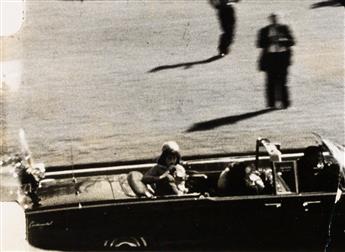 (KENNEDY, PRESIDENT JOHN F.--ASSASINATION) Group of 4 sequential photographs of frames from the Abraham Zapruder film.